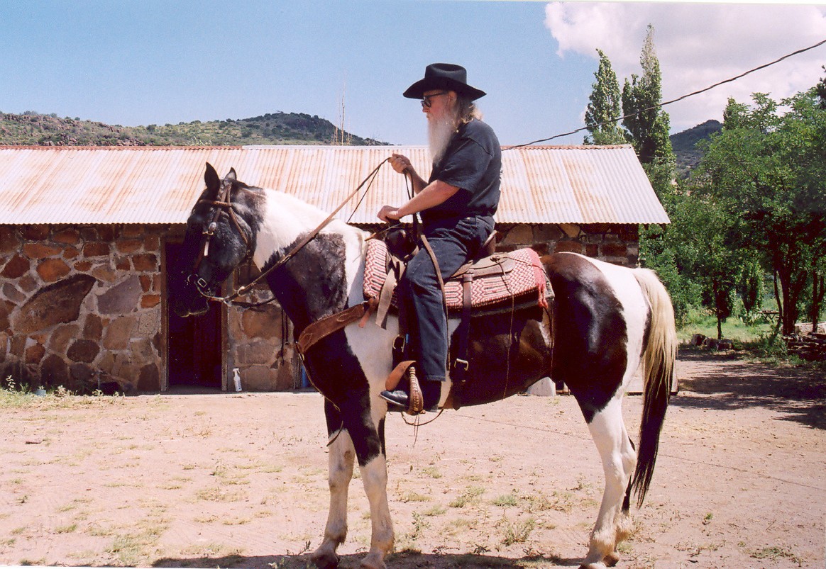 My dad. On a horse. In West Texas, I believe... My dad. On a horse